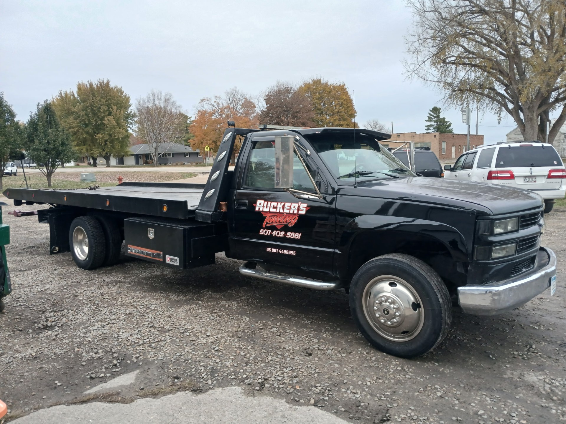 Ruckers Towing flatbed truck parked in Albert Lea, MN